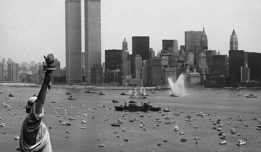 Ships participate in Operation Sail between the Statue of Liberty and the World Trade Center to celebrate the U.S. bicentennial in New York on July 4, 1976. (AP Photo/Eddie Adams, File)