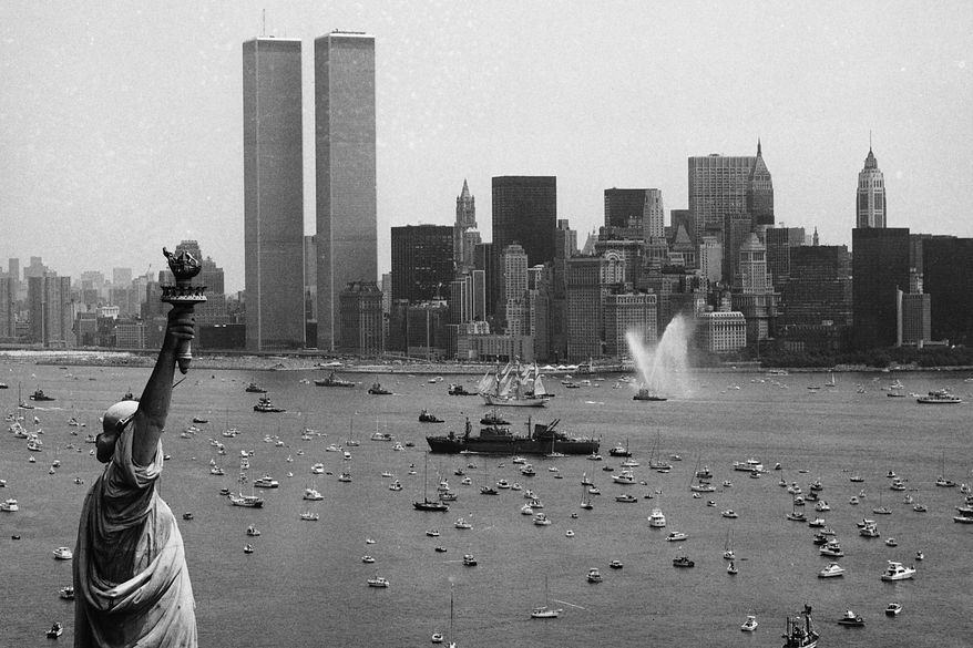 Ships participate in Operation Sail between the Statue of Liberty and the World Trade Center to celebrate the U.S. bicentennial in New York on July 4, 1976. (AP Photo/Eddie Adams, File)