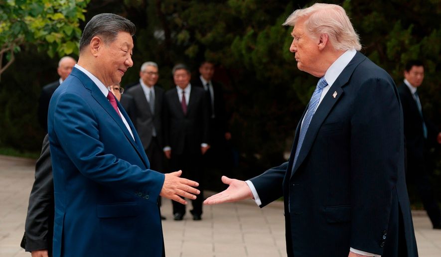 U.S. President Donald Trump, right, shakes hands with Chinese President Xi Jinping while leaving after a visit to the Zhongnanhai Garden in Beijing, Friday, May 15, 2026. (Evan Vucci/Pool Photo via AP, file)