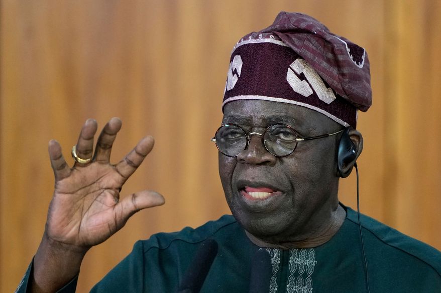 Nigeria's President Bola Tinubu gives a joint statement with Brazil's President Luiz Inacio Lula da Silva, at the Planalto presidential palace, in Brasilia, Brazil, Monday, Aug. 25, 2025. (AP Photo/Eraldo Peres, file)
