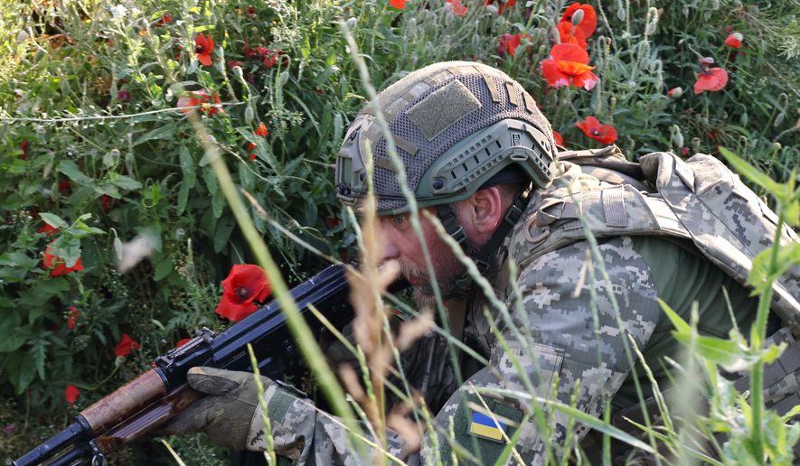 In this photo provided by Ukraine's 65th Mechanized Brigade press service, a soldier practices military skills at a training ground near the frontline in the Zaporizhzhia region, Ukraine, Thursday, June 11, 2026. (Andriy Andriyenko/Ukraine's 65th Mechanized Brigade via AP)