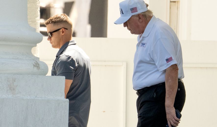 President Donald Trump walks to board his limousine at the North Portico of the White House, Saturday, June 13, 2026, in Washington. (AP Photo/Mark Schiefelbein)