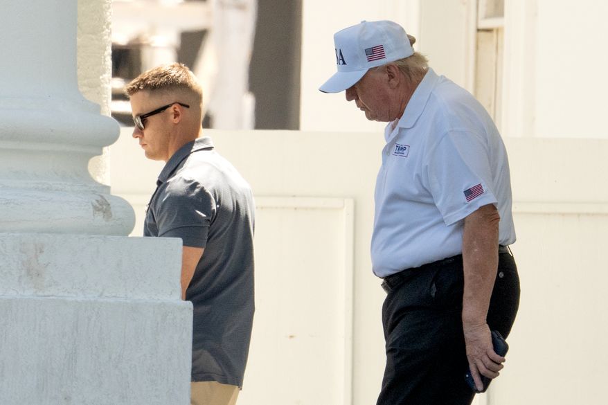 President Donald Trump walks to board his limousine at the North Portico of the White House, Saturday, June 13, 2026, in Washington. (AP Photo/Mark Schiefelbein)