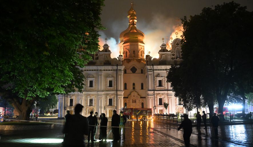 The roof of the Dormition Cathedral of the Kyiv-Pechersk Lavra burns, Monday, June 15, 2026. (AP Photo/Danylo Antoniuk)