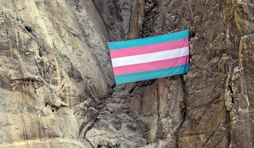 A group of climbers unfurls a trans pride flag on El Capitan in Yosemite National Park, Calif., on May 20, 2025. (Carlos Avila Gonzalez/San Francisco Chronicle via AP, File)