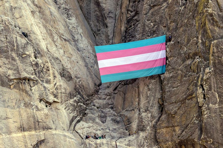 A group of climbers unfurls a trans pride flag on El Capitan in Yosemite National Park, Calif., on May 20, 2025. (Carlos Avila Gonzalez/San Francisco Chronicle via AP, File)