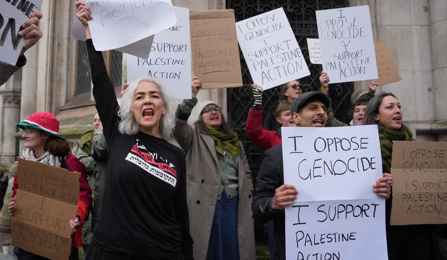 FILE - Supporters of Palestine Action stage a protest outside the Royal Court of Justice in London, Friday, Feb. 13, 2026. (AP Photo/Kin Cheung, File)