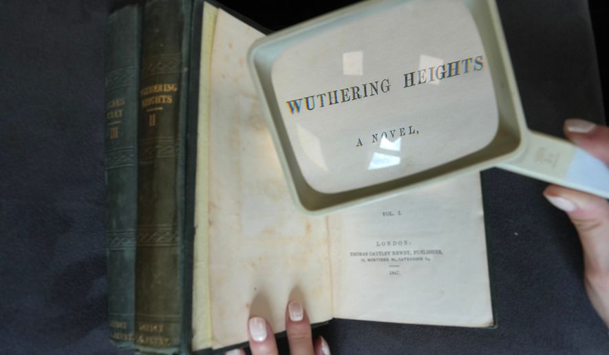 A first edition of Emily Bronte's Wuthering Heights, is on display for sale at Christie's auction house, with copies estimated at 400,000–600,000 GBP (540,000–810,000 USD) in London, Monday, June 15, 2026. (AP Photo/Kin Cheung)