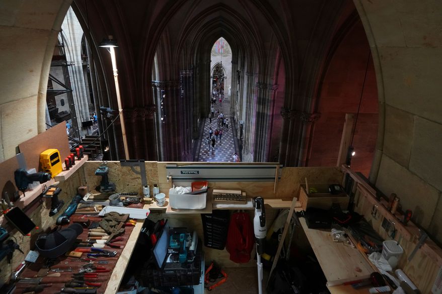 A makeshift work room is seen during the installation of a new organ at Prague's St. Vitus Cathedral that is coming to its final stages in Prague, Czech Republic, Tuesday, July 22, 2025. (AP Photo/Petr David Josek, File)