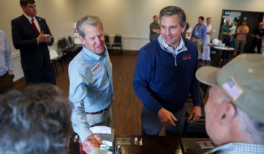 Gov. Brian Kemp, center left, and Republican U.S. Senate candidate Derek Dooley greet supporters at campaign stop for Dooley at Farmview Market in Madison, Ga., on May 8, 2026. (Arvin Temkar/Atlanta Journal-Constitution via AP, File)