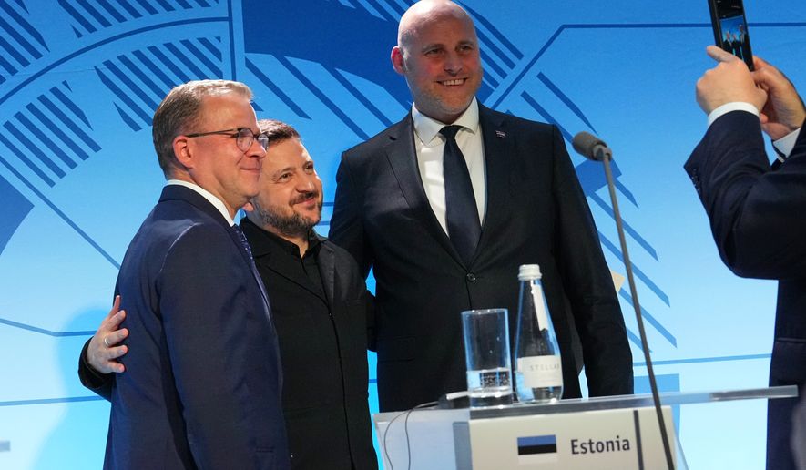 From left, Finnish Prime Minister Petteri Orpo, Ukraine's President Volodymyr Zelenskyy and Latvia's Prime Minister Andris Kulbergs pose for photo after a news conference at the Nordic and Baltic countries meeting in Tallinn, Estonia, Tuesday, June 9, 2026. (AP Photo/Sergei Grits)