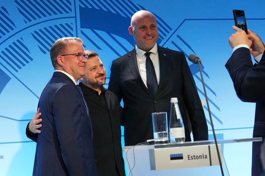 From left, Finnish Prime Minister Petteri Orpo, Ukraine's President Volodymyr Zelenskyy and Latvia's Prime Minister Andris Kulbergs pose for photo after a news conference at the Nordic and Baltic countries meeting in Tallinn, Estonia, Tuesday, June 9, 2026. (AP Photo/Sergei Grits)