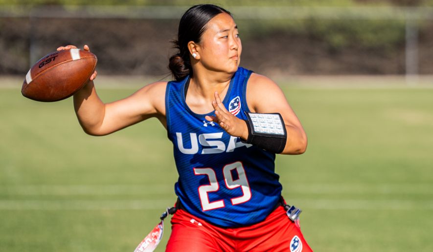 This photo provided by USA Football shows Akemi Higa, a player for the women’s national flag football team, winding up to pass at a USA Football training camp in Chula Vista, Calif., Friday, April 17, 2026. (Mina Creamer/USA Football via AP)