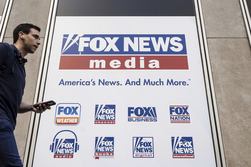 A person walks past the Fox News Headquarters in New York on April 12, 2023. (AP Photo/Yuki Iwamura, File)