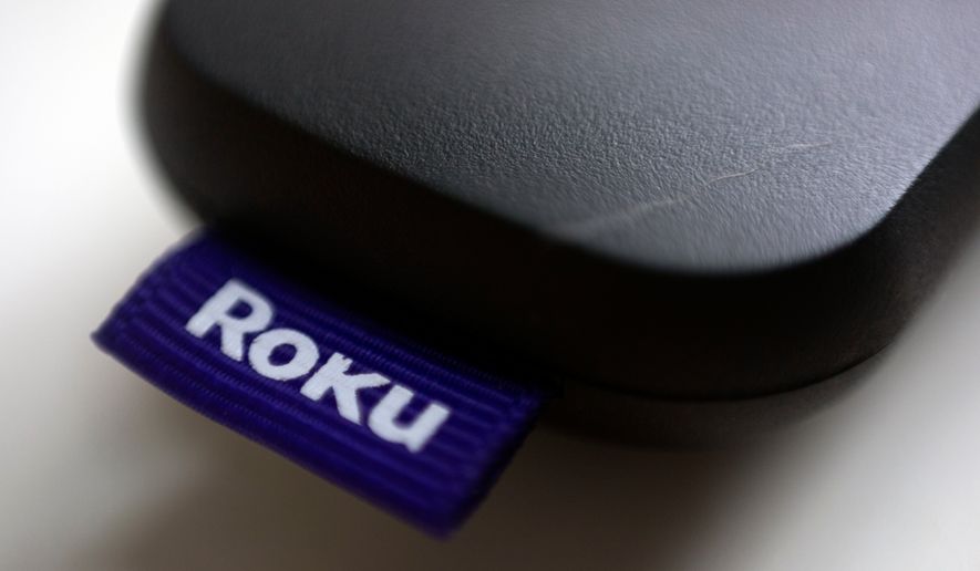 This Aug. 13, 2020, file photo shows a logo for Roku on a remote control in Portland, Ore. (AP Photo/Jenny Kane, file)