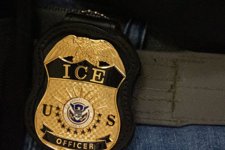 A federal agent wears an Immigration and Customs Enforcement badge in New York, June 10, 2025. (AP Photo/Yuki Iwamura, File)