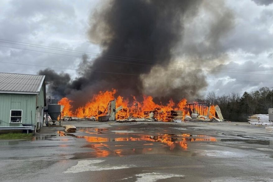 This photo provided by the Maine Department of Public Safety shows flames from a large fire at Robbins Lumber in Searsmont, Maine, May 15, 2026 (Maine Department of Public Safety via AP, File)
