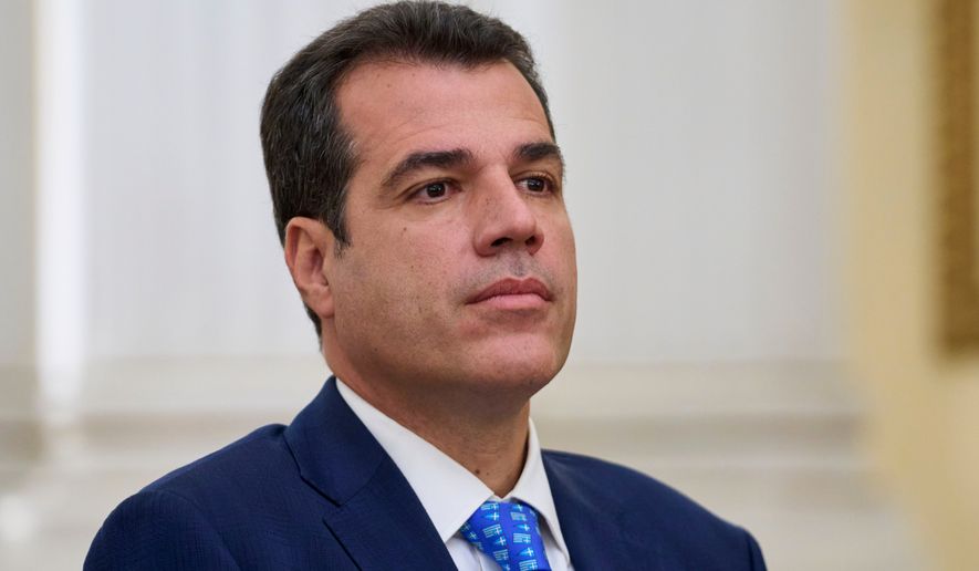 Greece's Migration Minister Thanos Plevris attends a swearing in ceremony at the Presidential palace, in Athens, on Monday, June 30, 2025. (AP Photo/Petros Giannakouris, File)