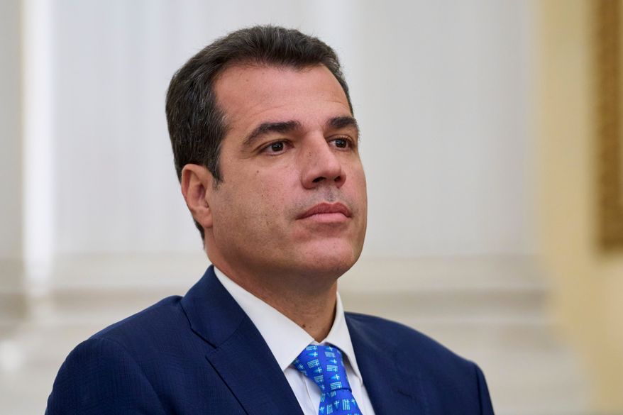 Greece's Migration Minister Thanos Plevris attends a swearing in ceremony at the Presidential palace, in Athens, on Monday, June 30, 2025. (AP Photo/Petros Giannakouris, File)
