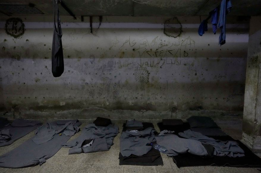 Blankets used by prisoners as mattresses are seen at a detention facility run by military intelligence during former Syrian President Bashar Assad's regime, in Damascus, Syria, on Dec. 17, 2024. (AP Photo/Hussein Malla, File)