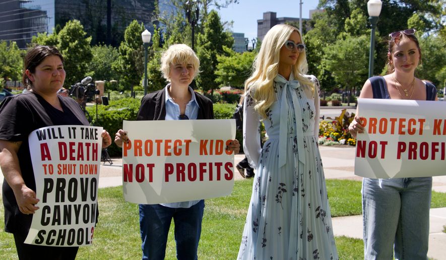 Paris Hilton appears alongside fellow survivors of residential teen treatment facilities, Monday, June 15, 2026, in Provo, Utah. (AP Photo/Hannah Schoenbaum)