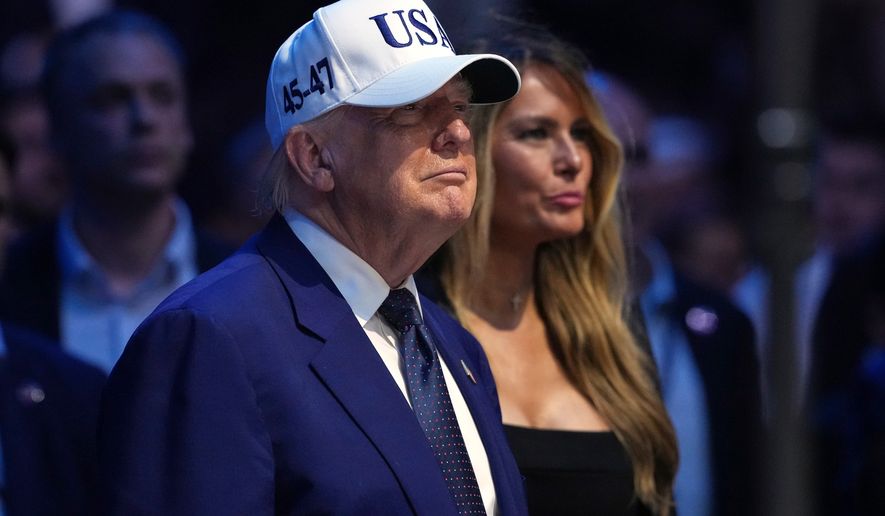 President Donald Trump, left, and first lady Melania Trump watch at the conclusion of UFC Freedom 250 on the South Lawn of the White House, Monday, June 15, 2026, in Washington. (AP Photo/Mark Schiefelbein)