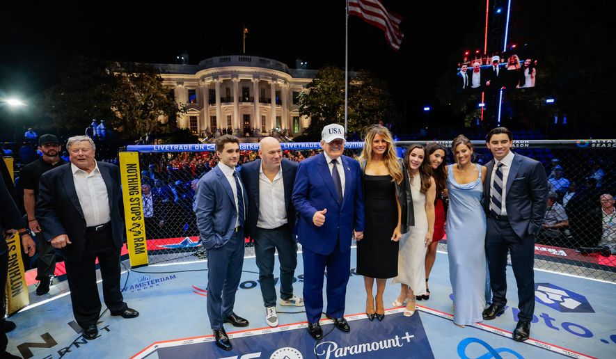 President Donald Trump, first lady Melania Trump, UFC President and CEO Dana White and other guests pose inside the octagon after UFC Freedom 250 on the South Lawn of the White House, Monday, June 15, 2026, in Washington. (Evan Vucci/Pool Photo via AP)