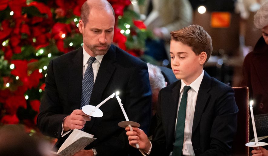 FILE - Britain's Prince William, left, and Prince George attend the Together At Christmas carol service at Westminster Abbey in London, Friday Dec. 5, 2025. (Aaron Chown/PA via AP, Pool, File)