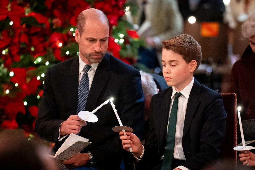 FILE - Britain's Prince William, left, and Prince George attend the Together At Christmas carol service at Westminster Abbey in London, Friday Dec. 5, 2025. (Aaron Chown/PA via AP, Pool, File)