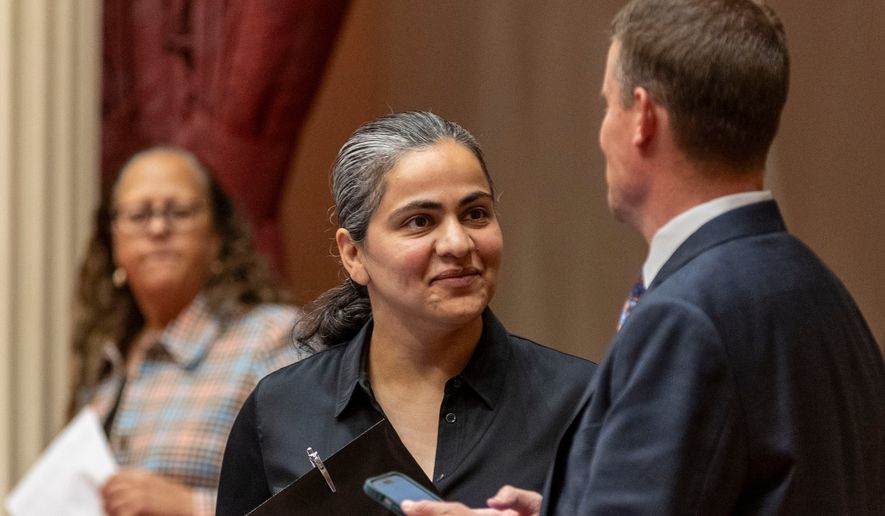 D-Calif. State Sen. Aisha Wahab stands with a colleague at the state legislature on Monday, June 15, 2026 in Sacramento, Calif. (AP Photo/Annie Barker)
