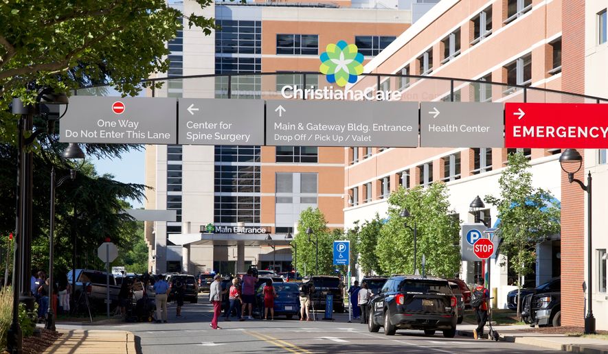 The main entrance to Wilmington Hospital is shown in the aftermath of a shooting on Tuesday, June 16, 2026, in Wilmington, Del. (AP Photo/Mingson Lau)