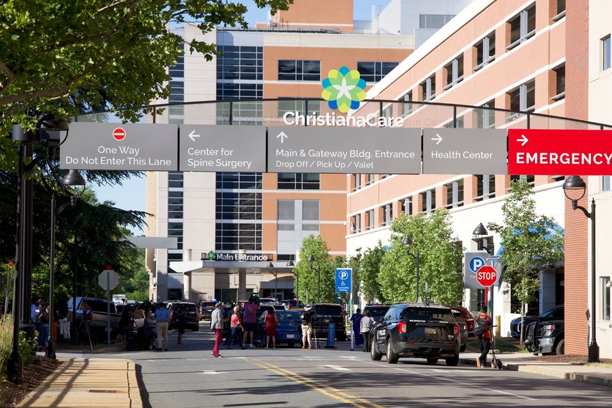 The main entrance to Wilmington Hospital is shown in the aftermath of a shooting on Tuesday, June 16, 2026, in Wilmington, Del. (AP Photo/Mingson Lau)