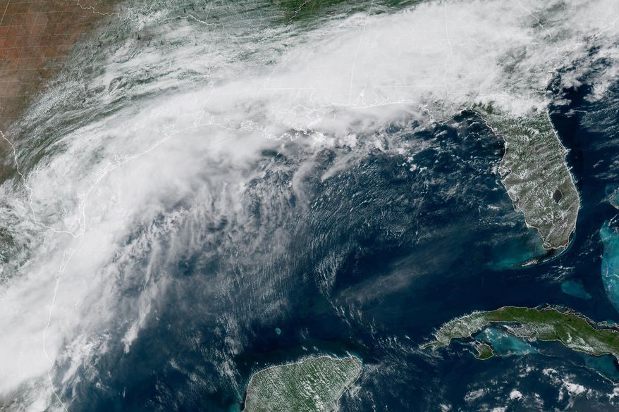 This GOES-19 GeoColor satellite image provided by NOAA, shows a storm system forming along the Gulf coast of Texas, on Tuesday, June 16, 2026. (NOAA via AP)