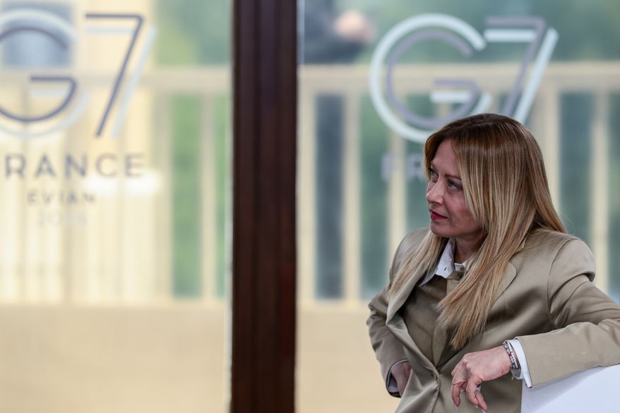 Italian Prime Minister Giorgia Meloni attends a working lunch with leaders of G7 and the Middle East, in Evian-les-Bains, France, Tuesday, June 16, 2026. (Evelyn Hockstein/Pool Photo via AP)