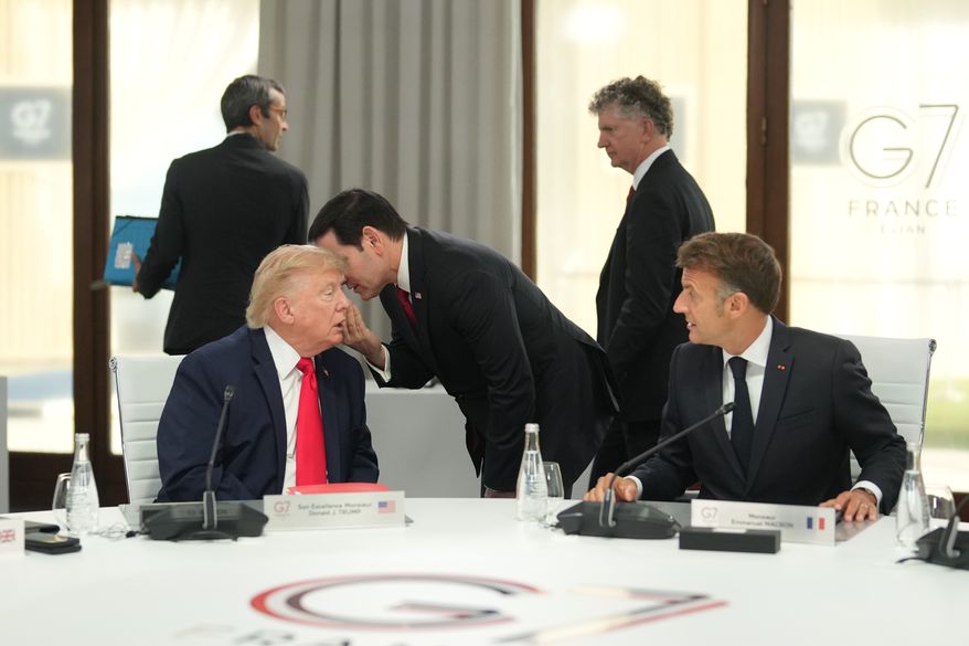 U.S. Secretary of State Marco Rubio, center, speaks with U.S. President Donald Trump, left, during a working session at the G7 summit in Evian-les-Bains, France, Tuesday, June 16, 2026. (AP Photo/Thibault Camus, Pool)