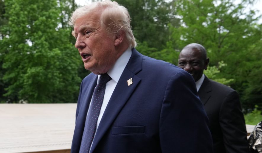 U.S. President Donald Trump walks away after a group photo of leaders at the G7 summit, Tuesday, June 16, 2026, in Evian-les-Bains, France. (AP Photo/Julia Demaree Nikhinson)