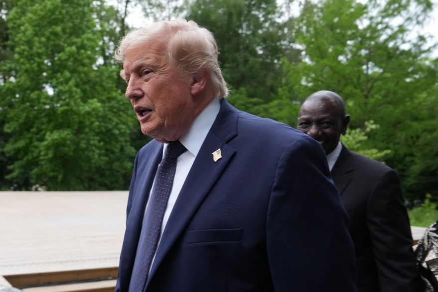 U.S. President Donald Trump walks away after a group photo of leaders at the G7 summit, Tuesday, June 16, 2026, in Evian-les-Bains, France. (AP Photo/Julia Demaree Nikhinson)