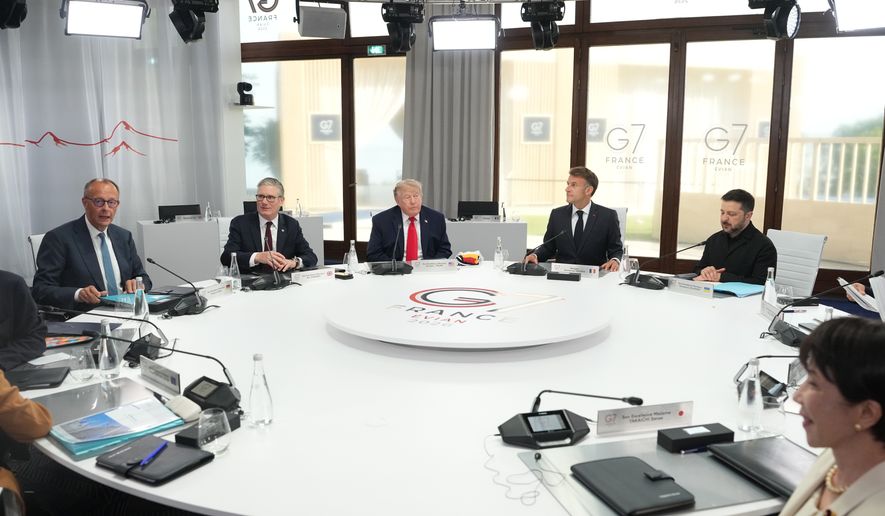 From left, German Chancellor Friedrich Merz, British Prime Minister Keir Starmer, U.S. President Donald Trump, French President Emmanuel Macron, Ukrainian President Volodymyr Zelenskyy and Japan's Prime Minister Sanae Takaichi during a working session at the G7 summit in Evian-les-Bains, France, Tuesday, June 16, 2026. (AP Photo/Thibault Camus, Pool)