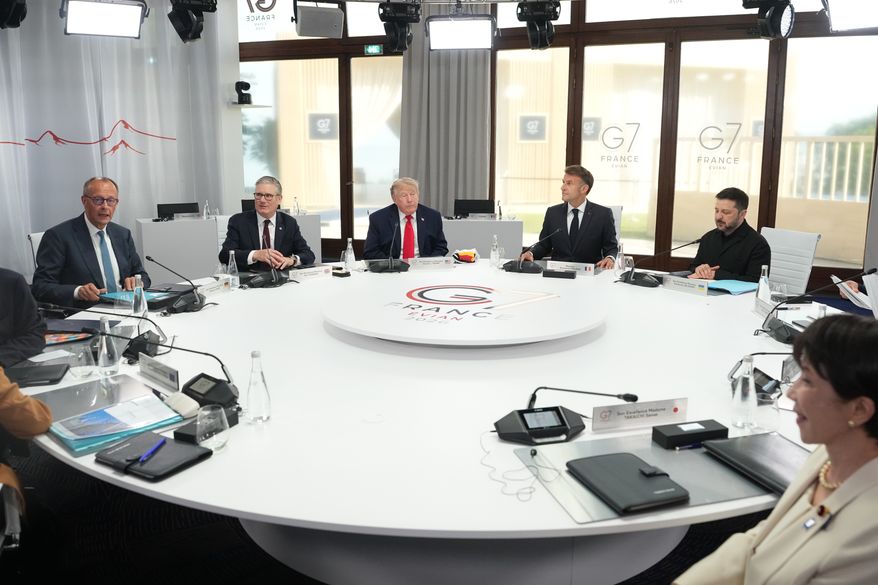 From left, German Chancellor Friedrich Merz, British Prime Minister Keir Starmer, U.S. President Donald Trump, French President Emmanuel Macron, Ukrainian President Volodymyr Zelenskyy and Japan's Prime Minister Sanae Takaichi during a working session at the G7 summit in Evian-les-Bains, France, Tuesday, June 16, 2026. (AP Photo/Thibault Camus, Pool)