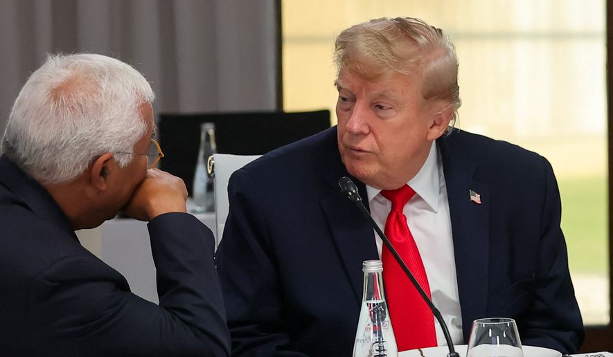 President Donald Trump listens to European Council President Antonio Costa, left, at a working lunch with leaders of G7 and the Middle East in Evian-les-Bains, France, Tuesday, June 16, 2026. (Christian Hartmann/Pool Photo via AP)
