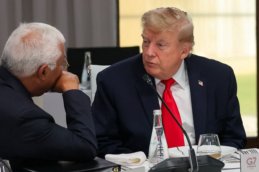 President Donald Trump listens to European Council President Antonio Costa, left, at a working lunch with leaders of G7 and the Middle East in Evian-les-Bains, France, Tuesday, June 16, 2026. (Christian Hartmann/Pool Photo via AP)