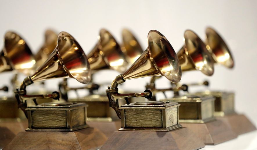 FILE - Grammy Awards are displayed at the Grammy Museum Experience at Prudential Center in Newark, N.J. on Oct. 10, 2017. (AP Photo/Julio Cortez, File)