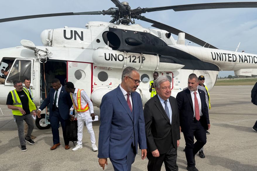 Haitian Prime Minister Alix Didier Fils-Aimé, front center, walks with U.N. Secretary-General Antonio Guterres as Guterres arrives to Port-au-Prince, Haiti, Tuesday, June 16, 2026. (AP Photo/Danica Coto)