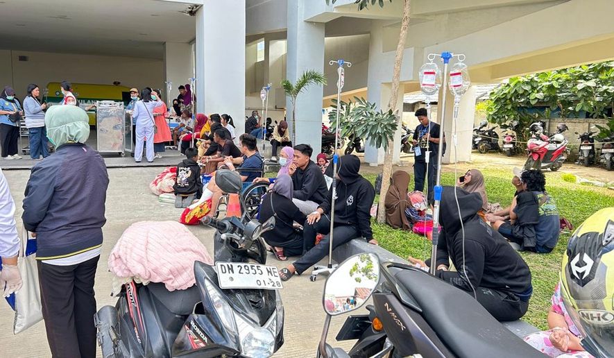 Patients are evacuated outside a local hospital following an earthquake in Palu, Central Sulawesi, Indonesia Tuesday, June 16, 2026. (AP Photo/Taufan Bustan)