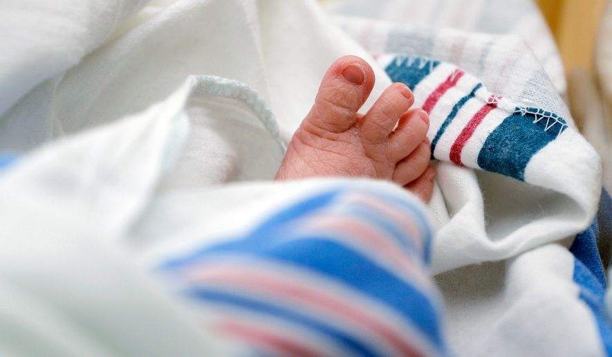 FILE - The toes of a baby peek out of a blanket at a hospital in McAllen, Texas, July, 29, 2020. (AP Photo/Eric Gay, File)
