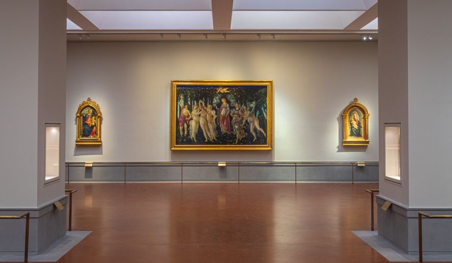 This picture made available Tuesday, June 16, 2026 shows a view of the renovated and refurbished Botticelli rooms, with Renaissance master Sandro Botticelli's paintings: "Spring ", center, "Madonna of the Rose Garden", left and "Madonna in glory with Seraphim" displayed at Florence's Uffizi Galleries, Italy. (Press Office of the Uffizi Gallery Museum via AP)