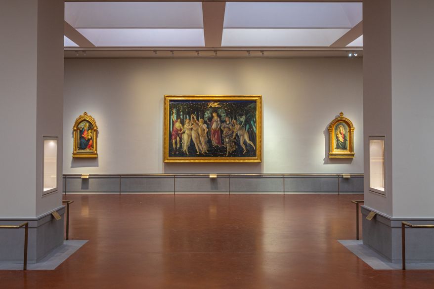 This picture made available Tuesday, June 16, 2026 shows a view of the renovated and refurbished Botticelli rooms, with Renaissance master Sandro Botticelli's paintings: "Spring ", center, "Madonna of the Rose Garden", left and "Madonna in glory with Seraphim" displayed at Florence's Uffizi Galleries, Italy. (Press Office of the Uffizi Gallery Museum via AP)