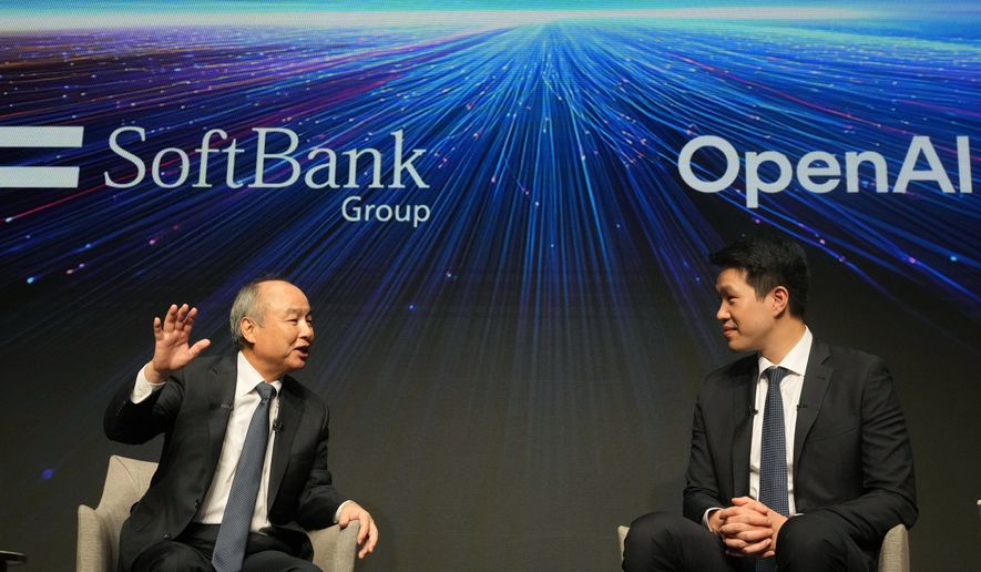 Masayoshi Son, left, chairman and CEO of SoftBank Group, speaks as Mark Chen, chief research officer for OpenAI, listens during a talk at their business event at a hotel in Tokyo, Tuesday, June 16, 2026. (AP Photo/Hiro Komae)
