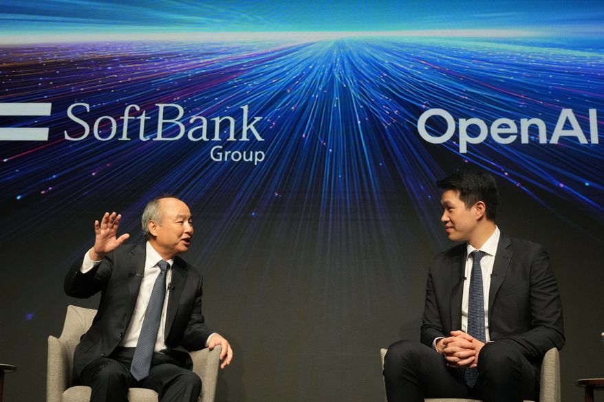 Masayoshi Son, left, chairman and CEO of SoftBank Group, speaks as Mark Chen, chief research officer for OpenAI, listens during a talk at their business event at a hotel in Tokyo, Tuesday, June 16, 2026. (AP Photo/Hiro Komae)