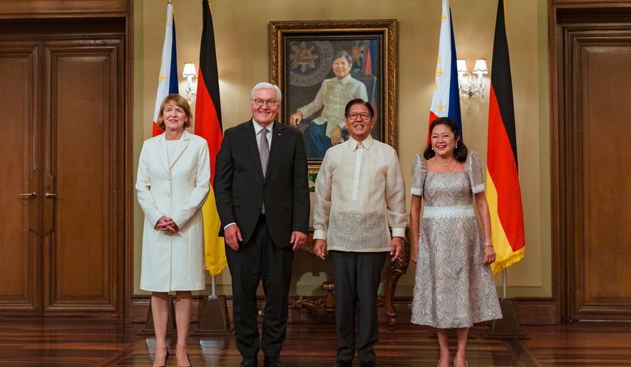 German President Frank-Walter Steinmeier, center left, with his wife Elke Budenbender, left, and Philippine President Ferdinand Marcos Jr. with his wife Liza Araneta Marcos pose for pictures in Manila, Philippines Tuesday, June 16, 2026. (Ezra Acayan/Pool Photo via AP)